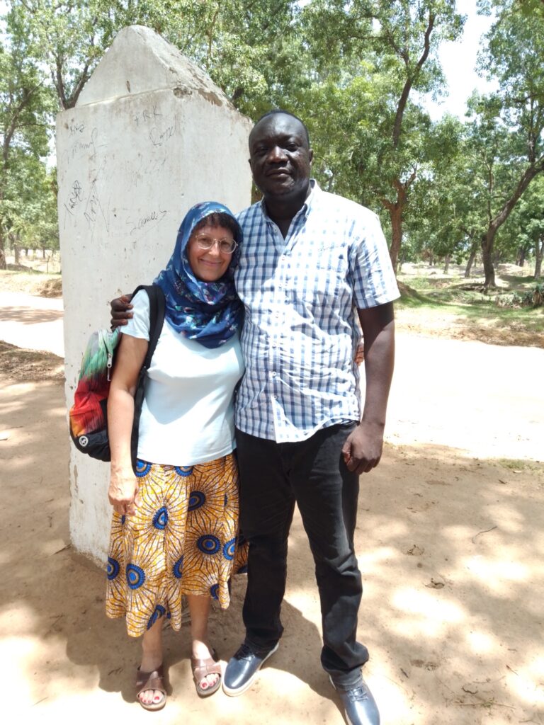 Margaret and Celestin in the middle of Africa